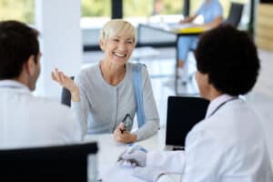 Woman speaking with doctor during MAT New Jersey consultation