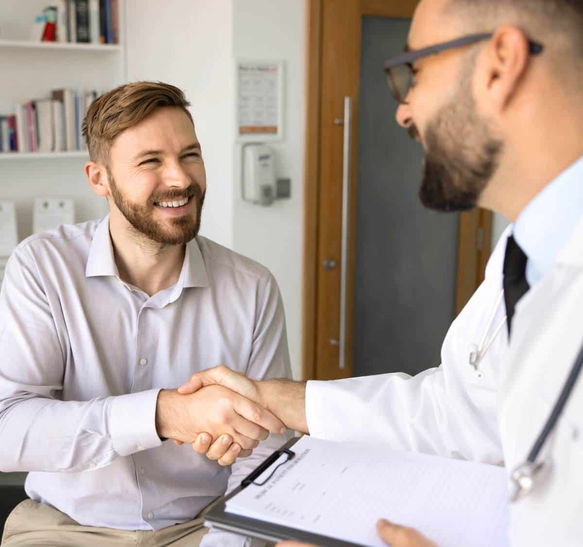 Man meeting with a doctor for drug addiction treatment in Greensboro, NC.