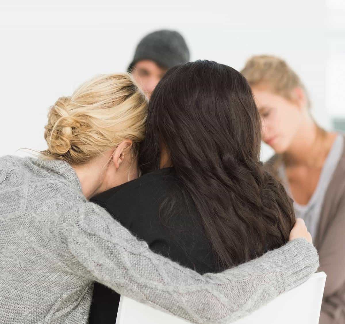 Peer support moment in drug addiction treatment in Greensboro, NC.