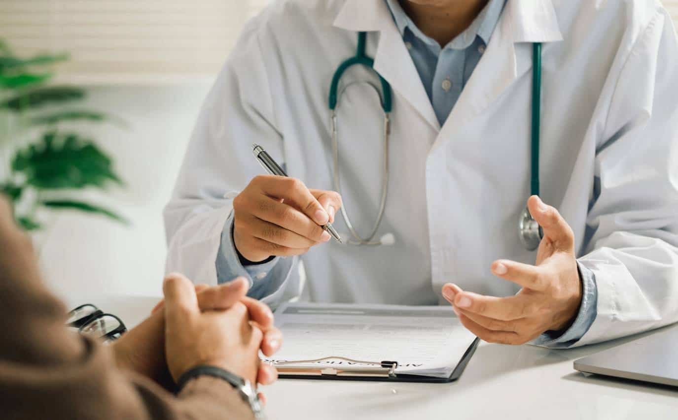 Medical professional guiding a client during dual diagnosis treatment in Greensboro, NC.
