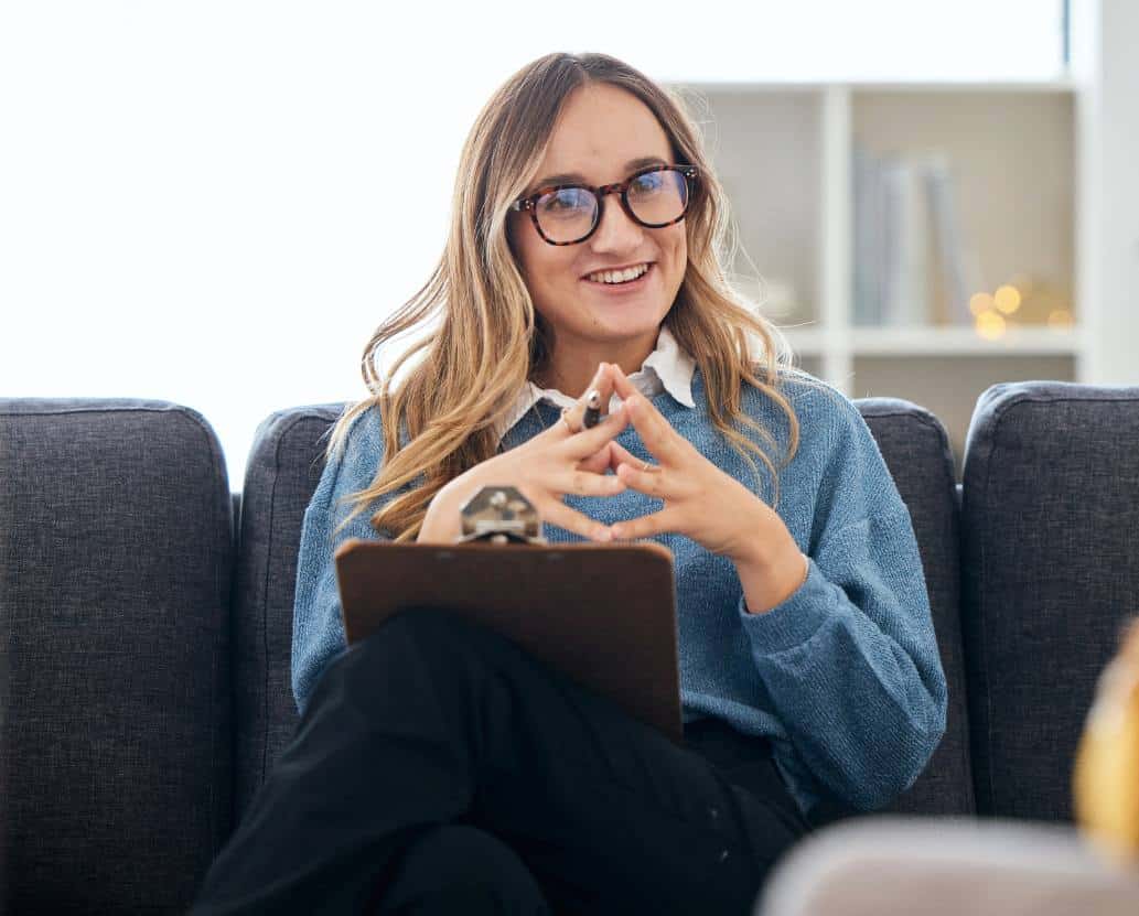 Therapist offering support and direction during a session at 1Eleven.
