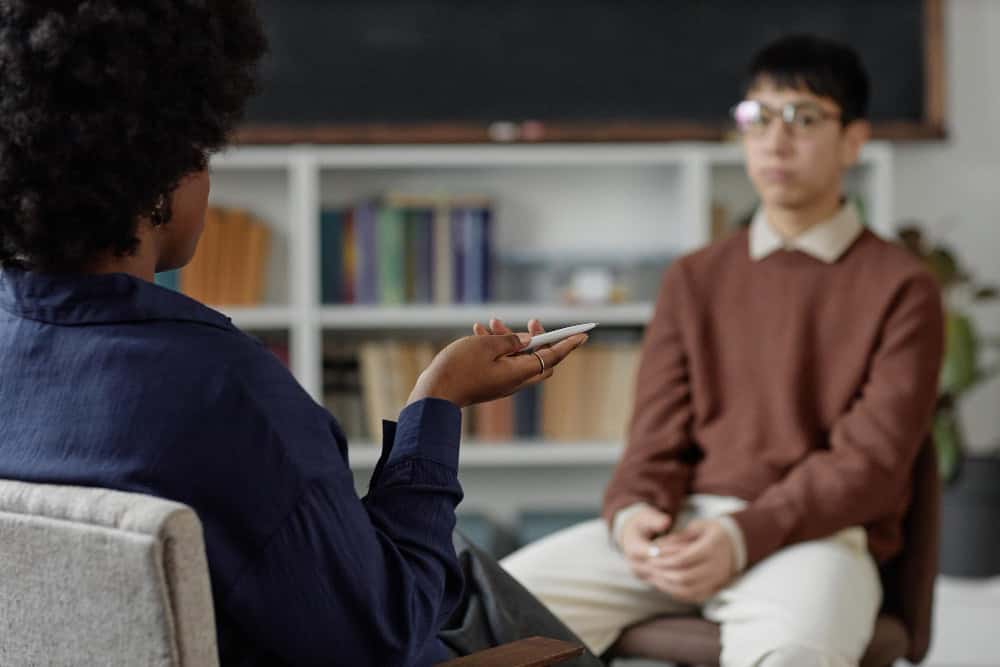 Therapist talking to man during mental health PHP in Greensboro NC session