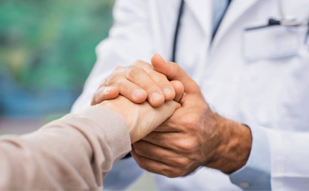Client receiving reassurance from a doctor in addiction treatment PHP in Greensboro, NC.