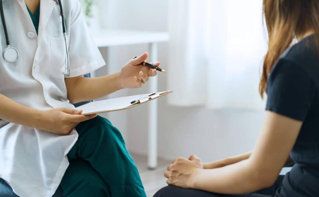 Doctor reviewing care plan with a client in addiction treatment PHP in Greensboro, NC.