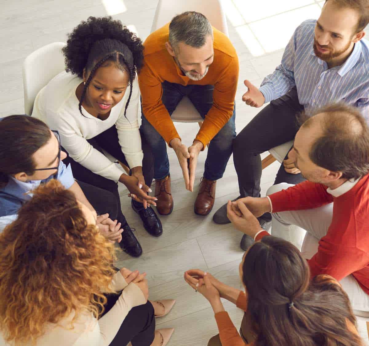 Clients in group therapy as part of addiction treatment programs in Greensboro, North Carolina.