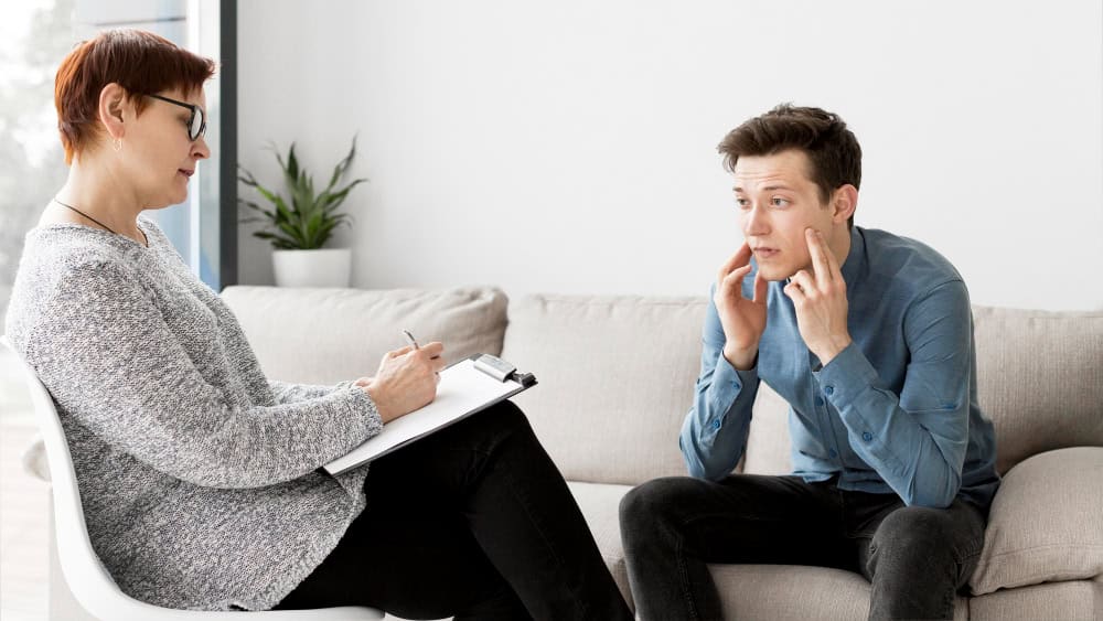 Psychologist speaking with a patient during ADHD therapy in Greensboro, NC at 1Eleven Behavioral Health.