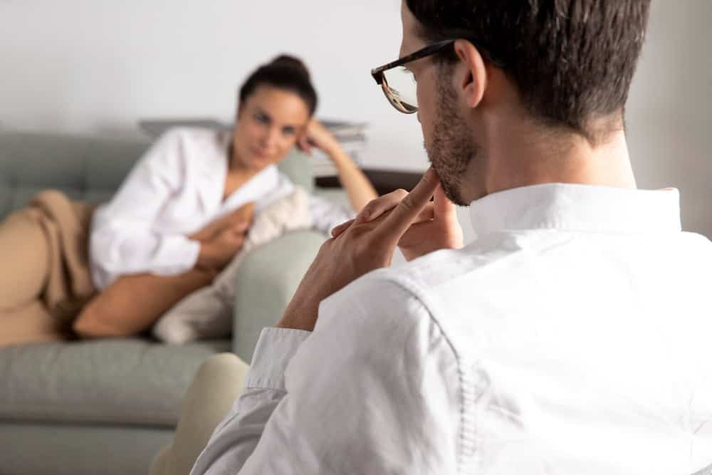 Young person talking with a mental health specialist during bipolar disorder treatment in Greensboro, NC.