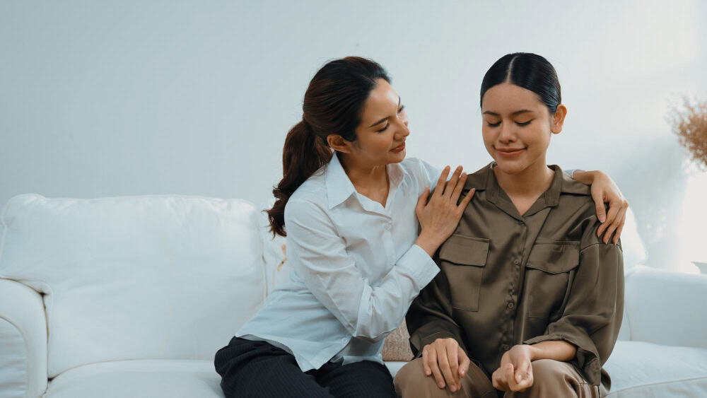 Supportive hands offering comfort during behavioral health treatment.